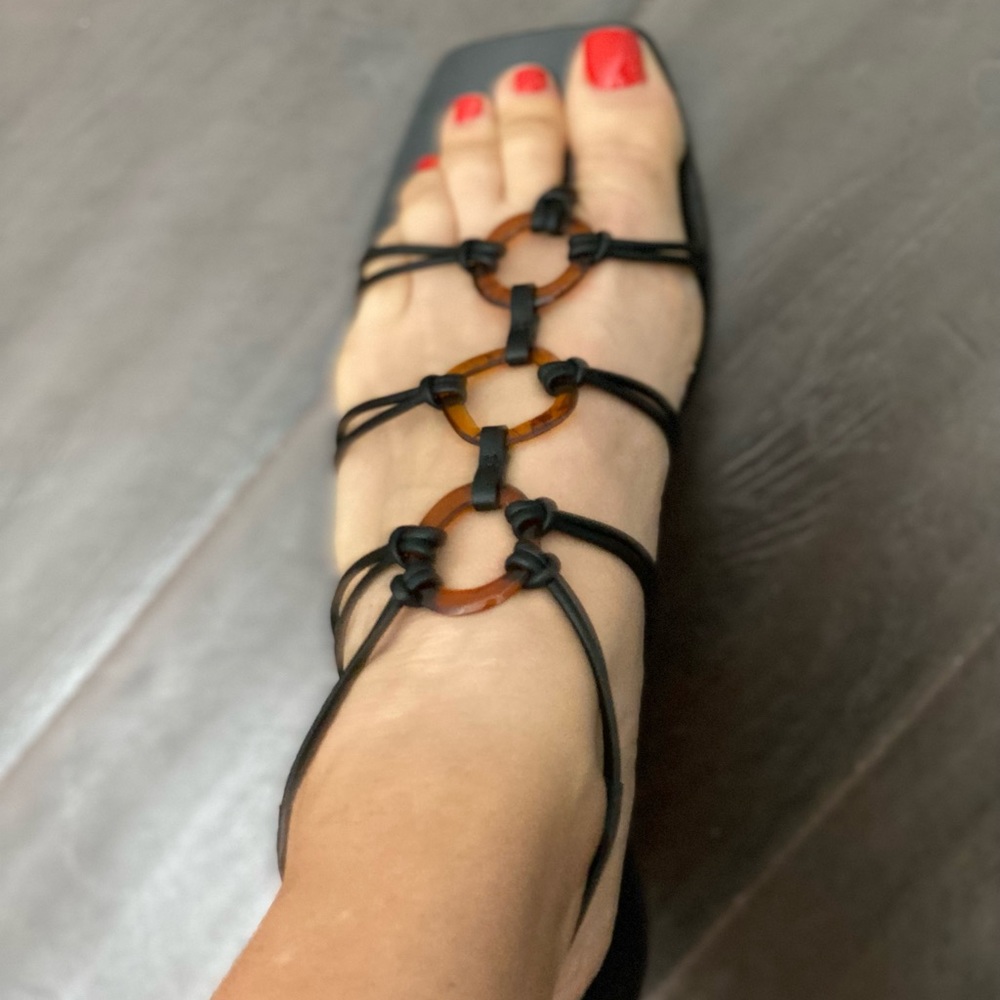 Cult Gaia size 39 black sandal with tortoise colored detail.